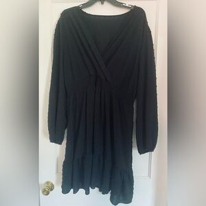 Black cocktail party dress with dot accents